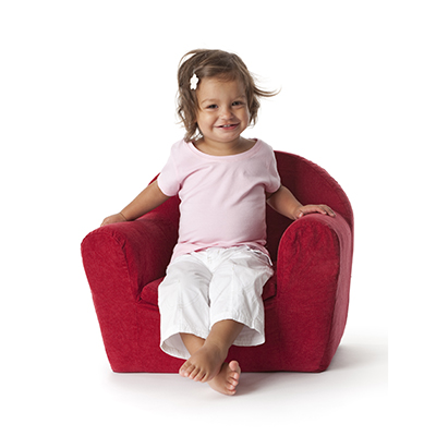 Toddler sitting in armchair